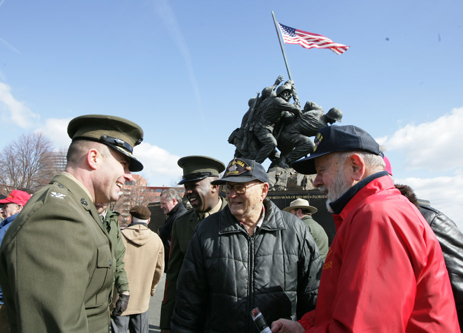 Col William K. Lietzau enjoyed the stories told by Gordon Ward (center) and Jack Colby after the ceremony.