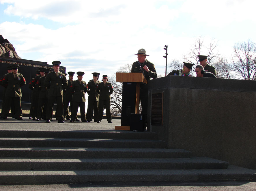 Jon James, Deputy Superintendent, George Washington Memorial Parkway, welcomed the audience to the commemoration ceremony. Park Service representatives greeted attendees with informational brochures about the Marine Corps War Memorial, which the National Park Service oversees.